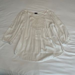 Vintage flowy white peplum-inspired blouse with lace panelling